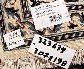 A carpet, Nain, part silk, ca 307 x 198 cm.