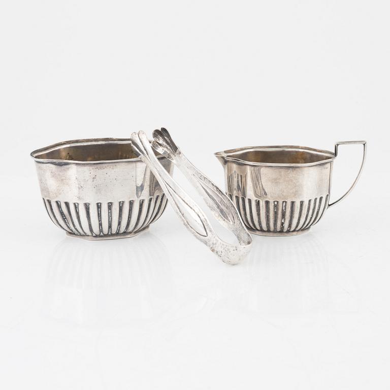 Creamer, sugar bowl, and sugar tongs, silver.