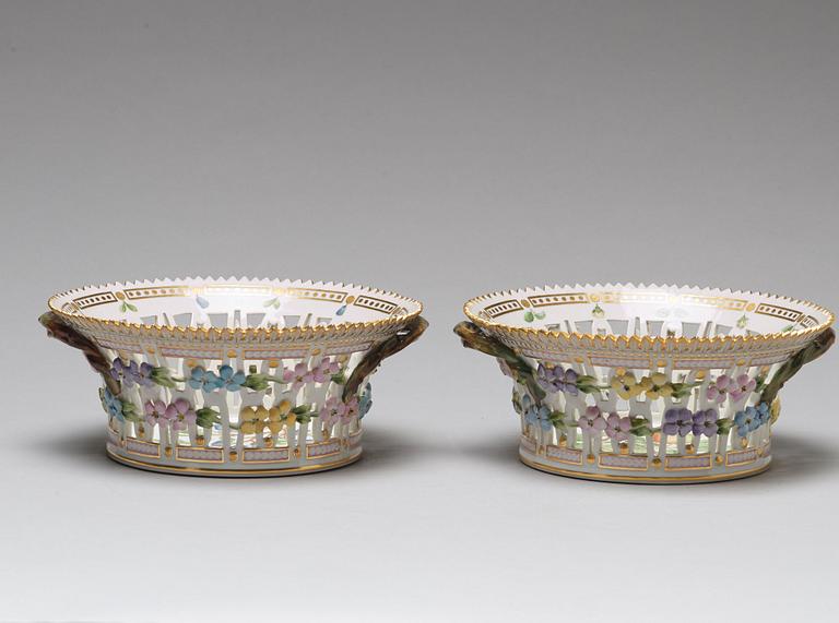 A pair of Royal Copenhagen "Flora Danica" chesnut baskets with stands, Denmark, mid 20th Century.