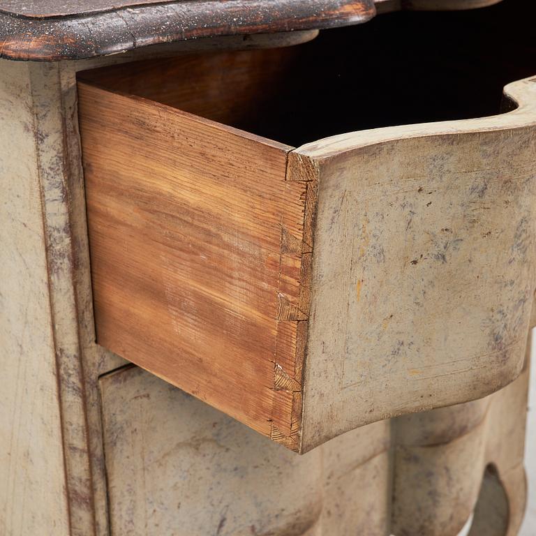 A painted Baroque style chest of drawers, early 20th Century.