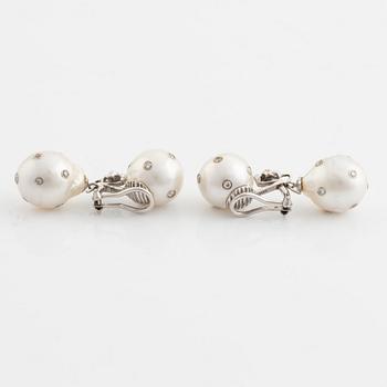 Cultured South sea pearl and brilliant cut diamond earrings.