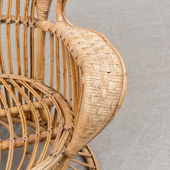 a rattan chair by Gio Ponti & Lio Carminati, Italy, second half of the 20th century.