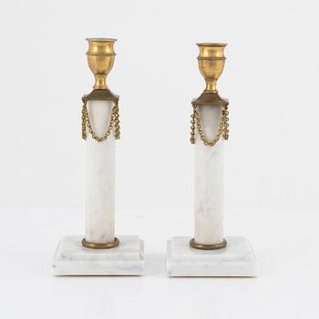 A pair of Gustavian style candlesticks, circa 1900.