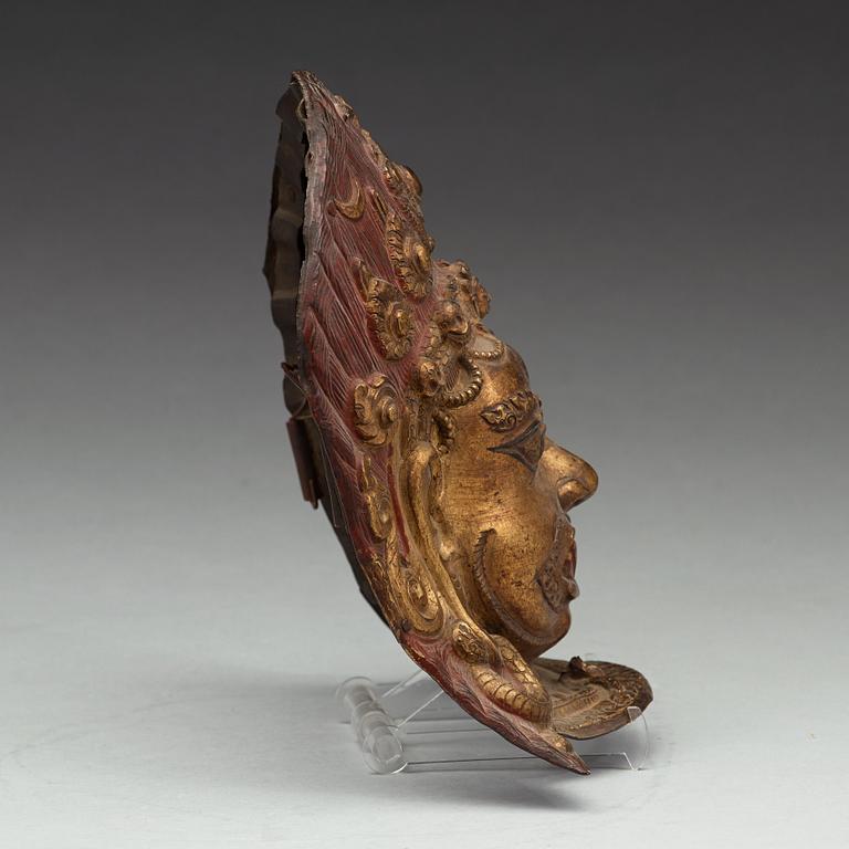 A copper alloy repousse mask, Nepal, presumably 17/18th Century.