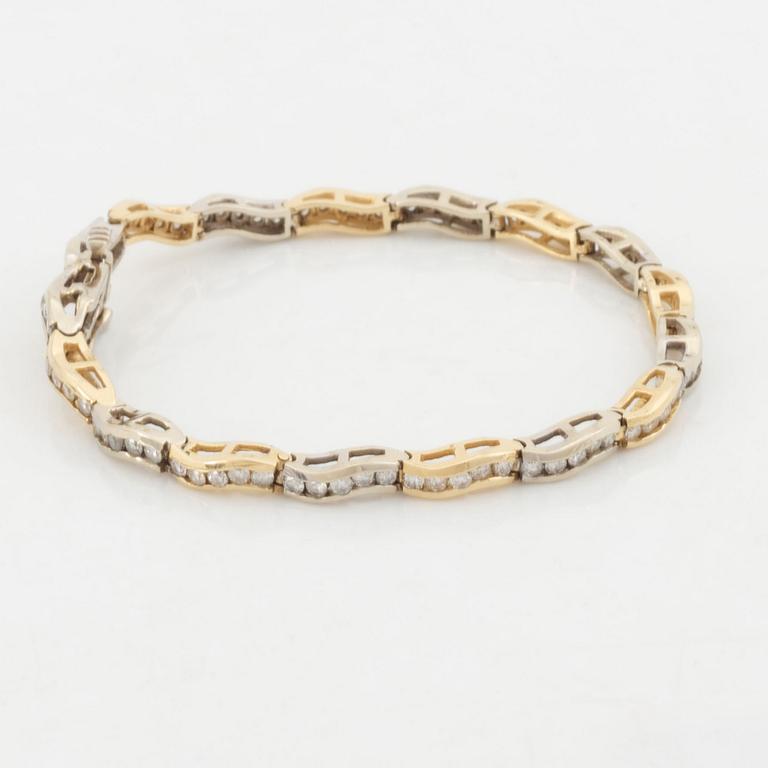 14K gold and brilliant cut diamond bracelet, with extra link.