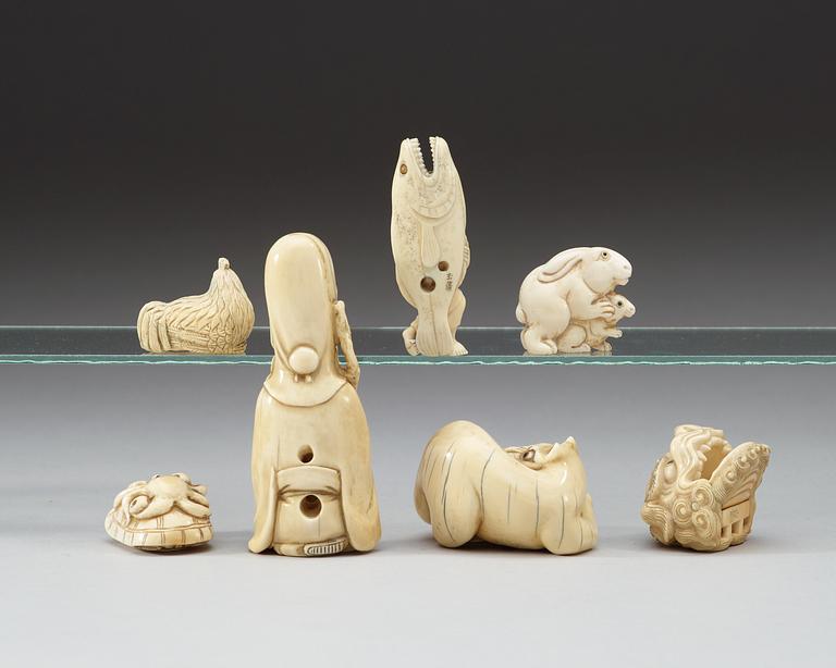 A set of six ivory netsukes and an Okimono, Japan, Meiji (1868-1912).