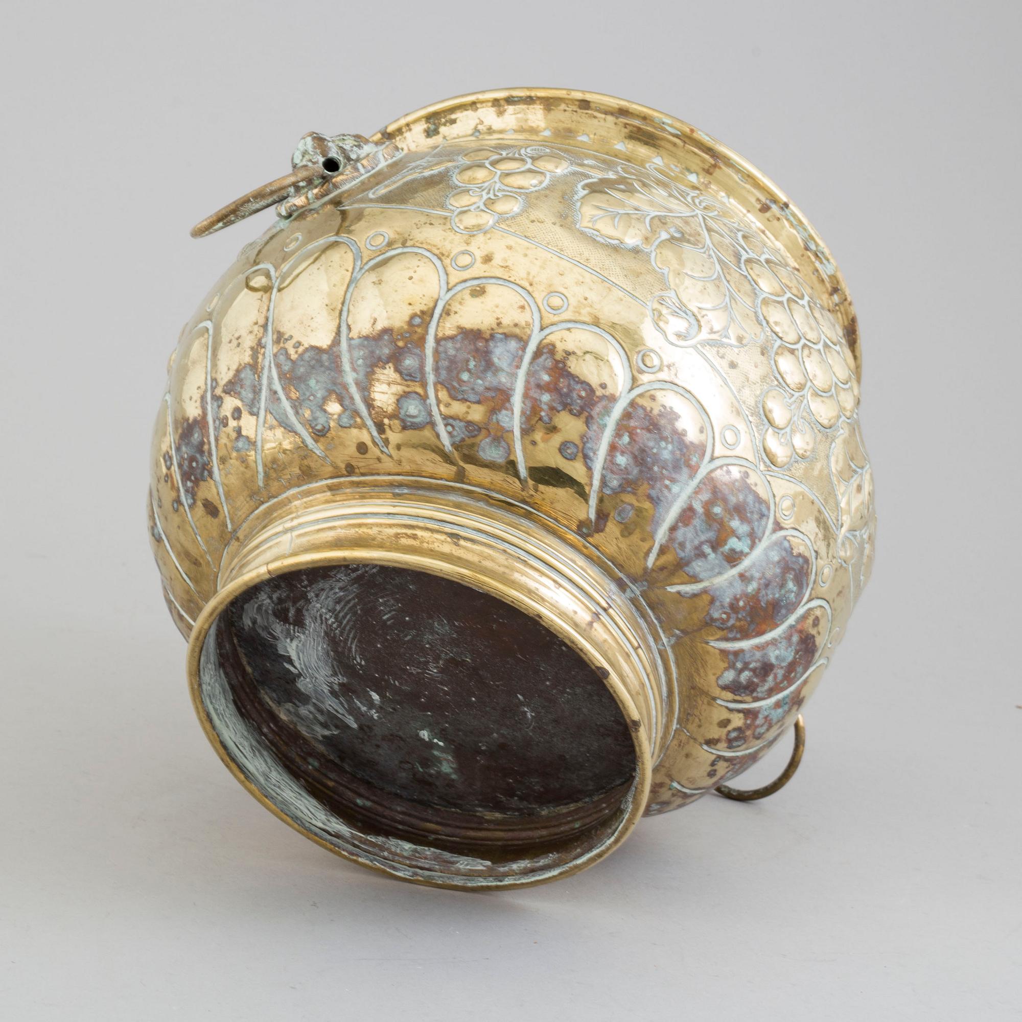 A 19TH CENTURY BRASS FLOWER POT.