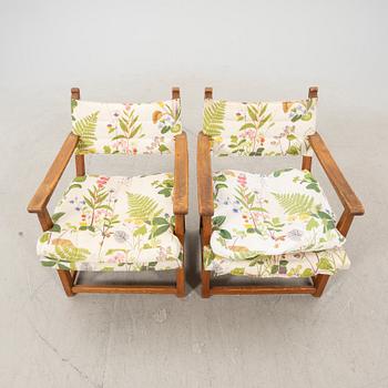 Carl Malmsten, a pair of pine armchairs "Hängsits" 1940-s.