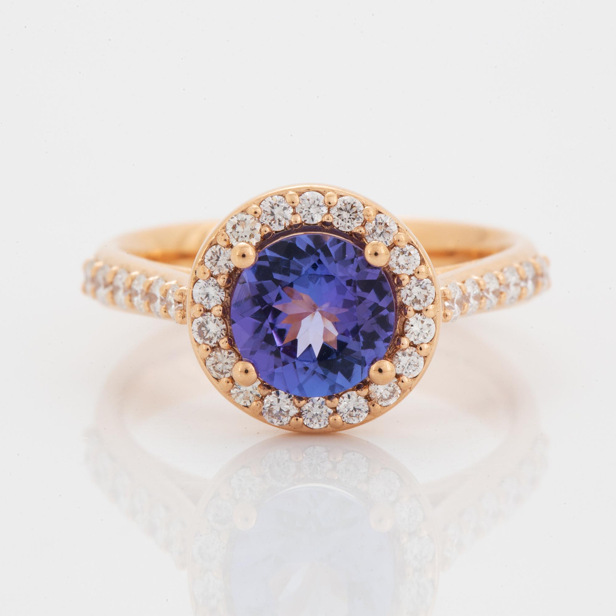 Ring 18K guld med en fasettslipad tanzanit.