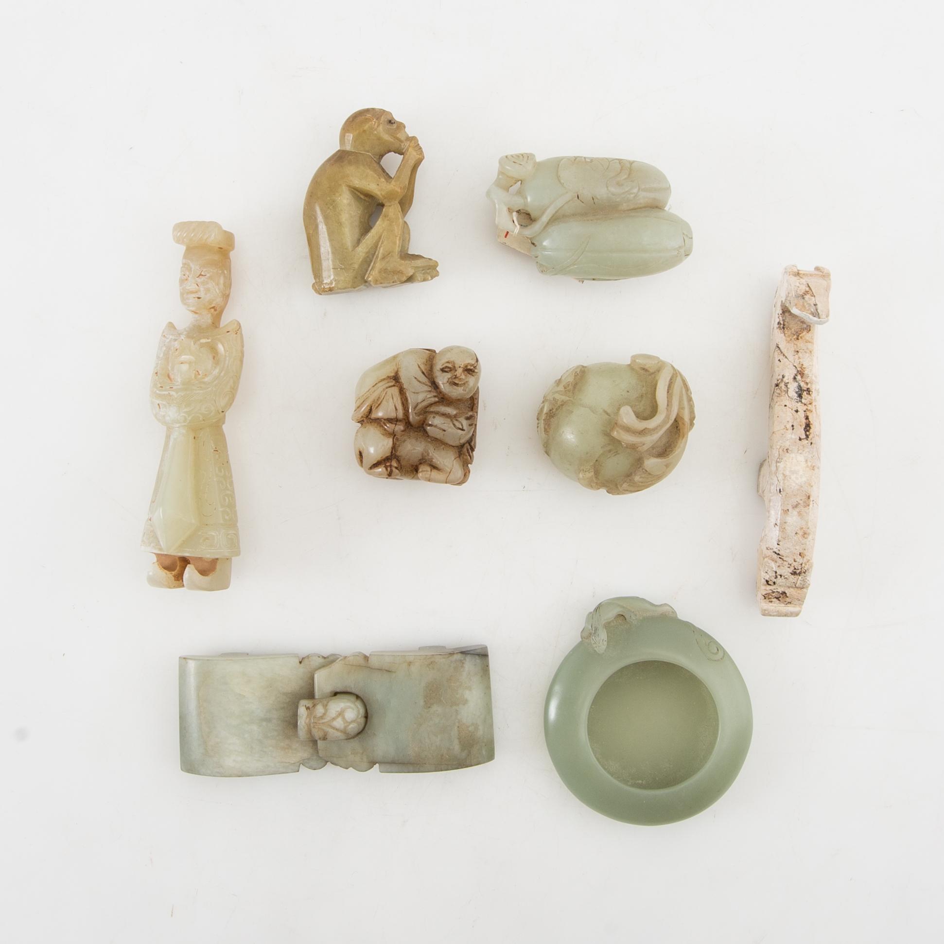 Figurines, belt buckles etc. China.