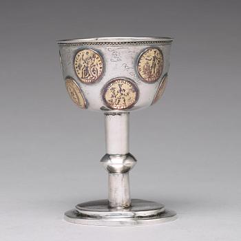A Swedish 18th century parcel-gilt silver tumbler / cup, with copper coins, unmarked.