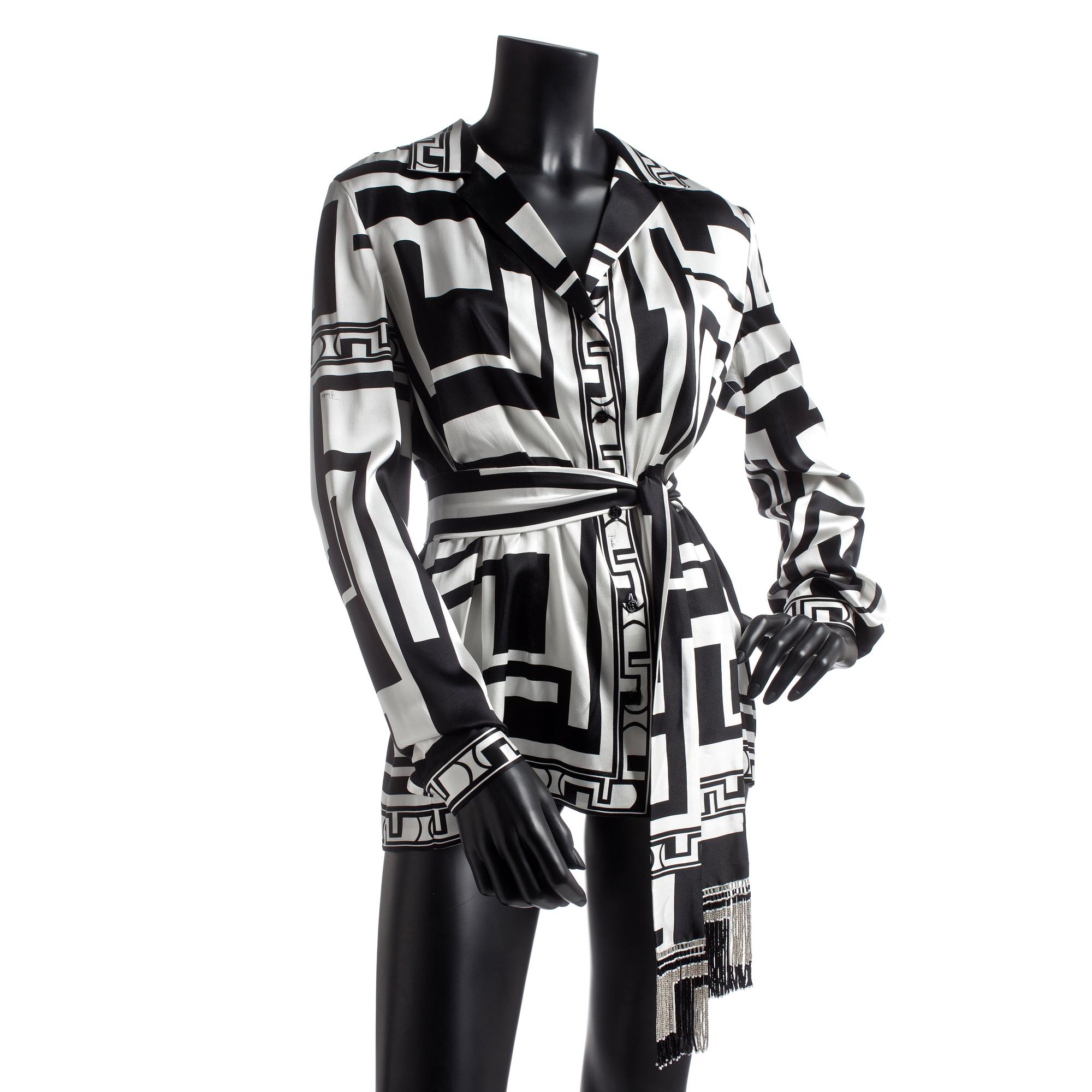 EMILIO PUCCI, a silk shirt with belt.