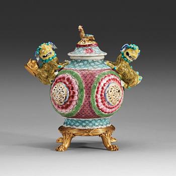 38. A gilt bronze mounted famille rose tea pot with cover, Qing dynasty, Yongzheng (1723-35).