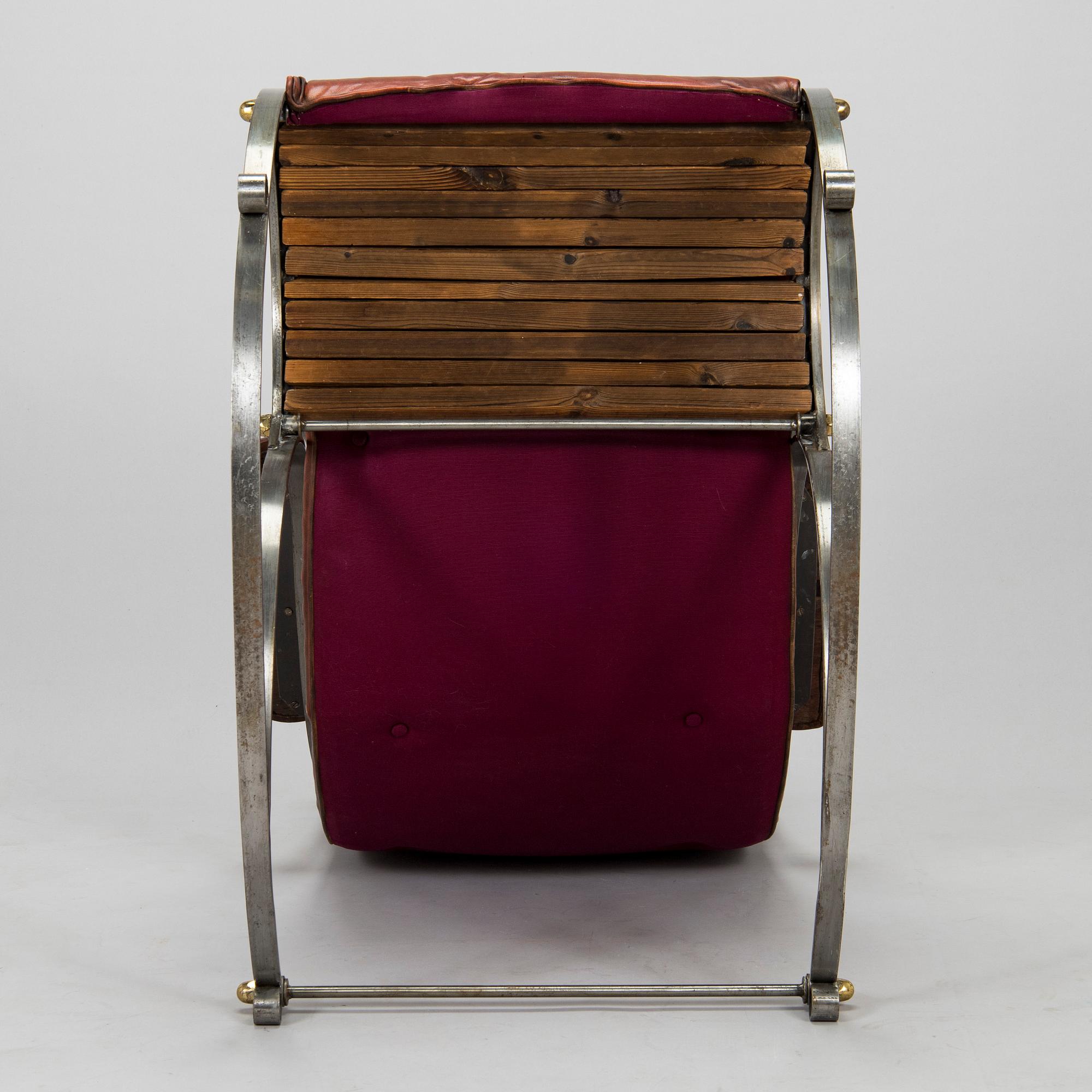 A 20th century steel frame rocking chair.