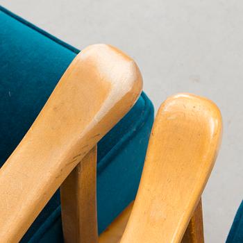 A pair of mid 20th century '2402 Armi' armchairs by Ilmari Lappalainen/Olavi Lieto, Asko, Finland.