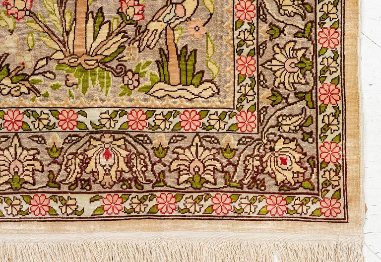 A silk an metal Hereke rug, West Anatolia, c. 100 x 68 cm.