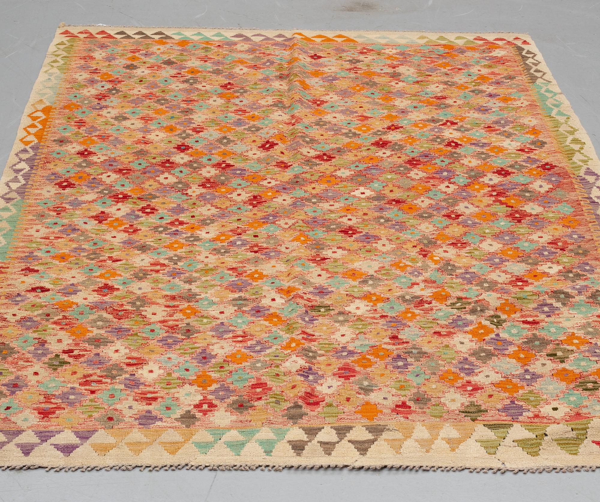 A RUG, kilim 236 x 159 cm.
