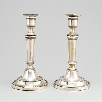 A pair of late 18th century/early 19th century plate candlesticks.