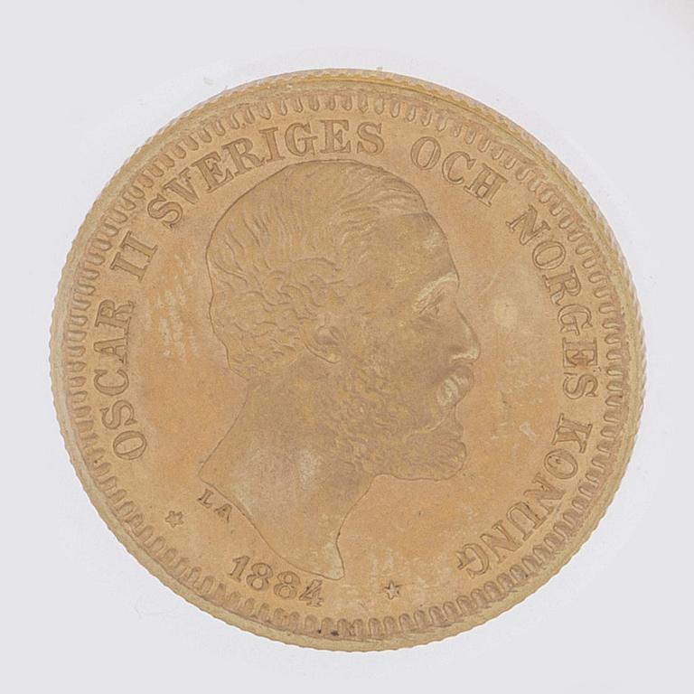 MYNT, guld, 20 kronor, Oscar II, 1884, vikt ca 9 g.