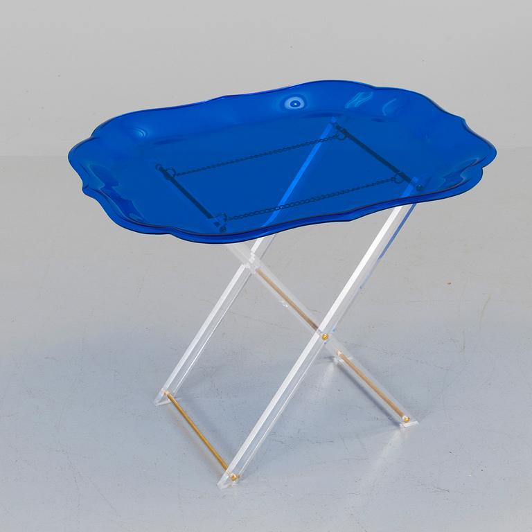 A plastic tray table, probably from Spisani, Italy.