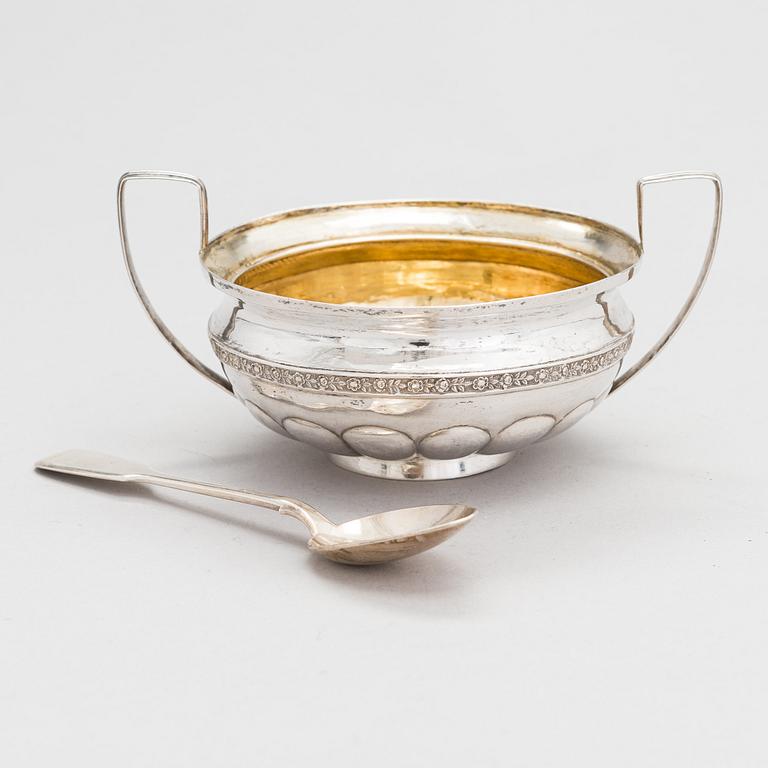 A silver sugar bowl, 1825 and a Hlebnikov silver spoon, early 1900s, both from Moscow.