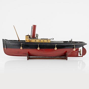 A ships model of a tugboat for a steam engine.