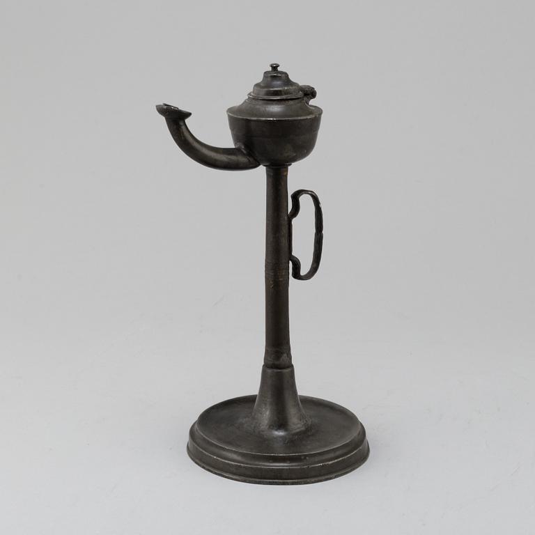 An 18th century pewter oil lamp.