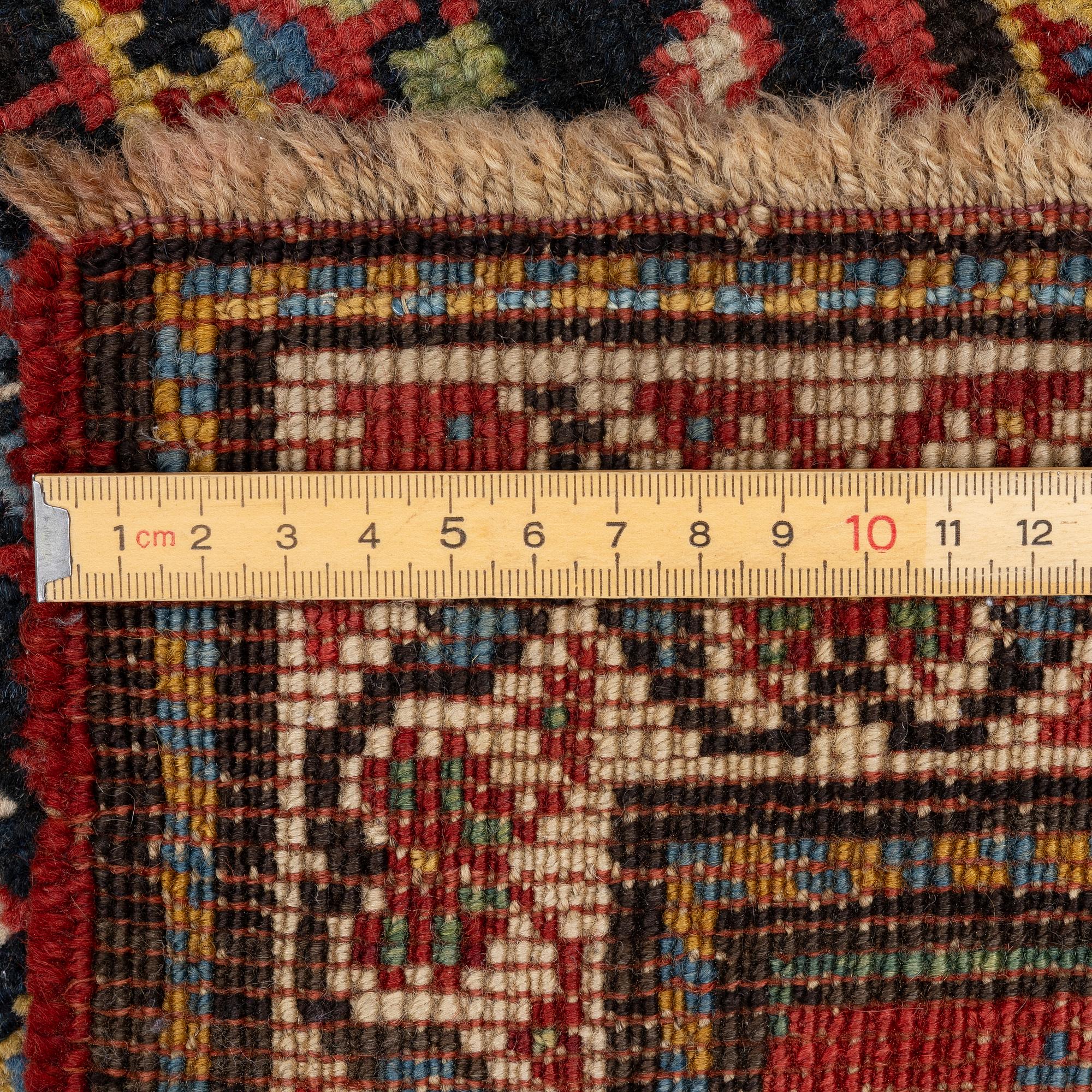 A semi-antique Karagabh rug, c. 264 x 108 cm.