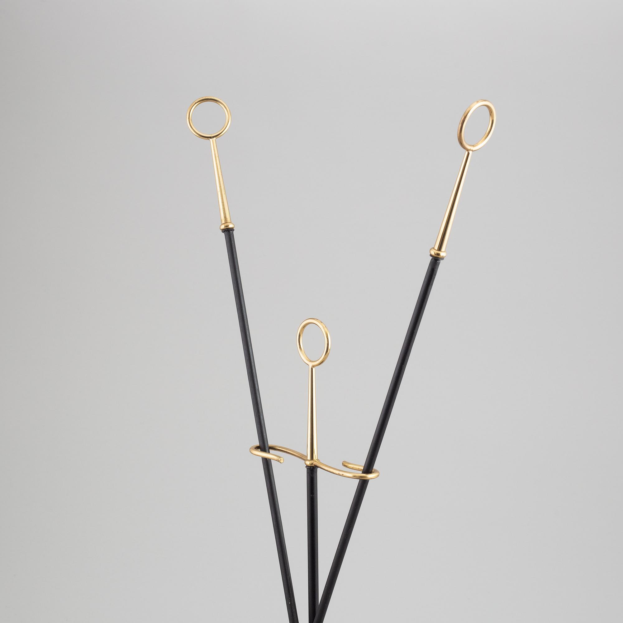 A fireplace stand of three parts by Gunnar Ander for Ystad Metall.