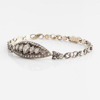 A silver bracelet with rose-cut diamonds.