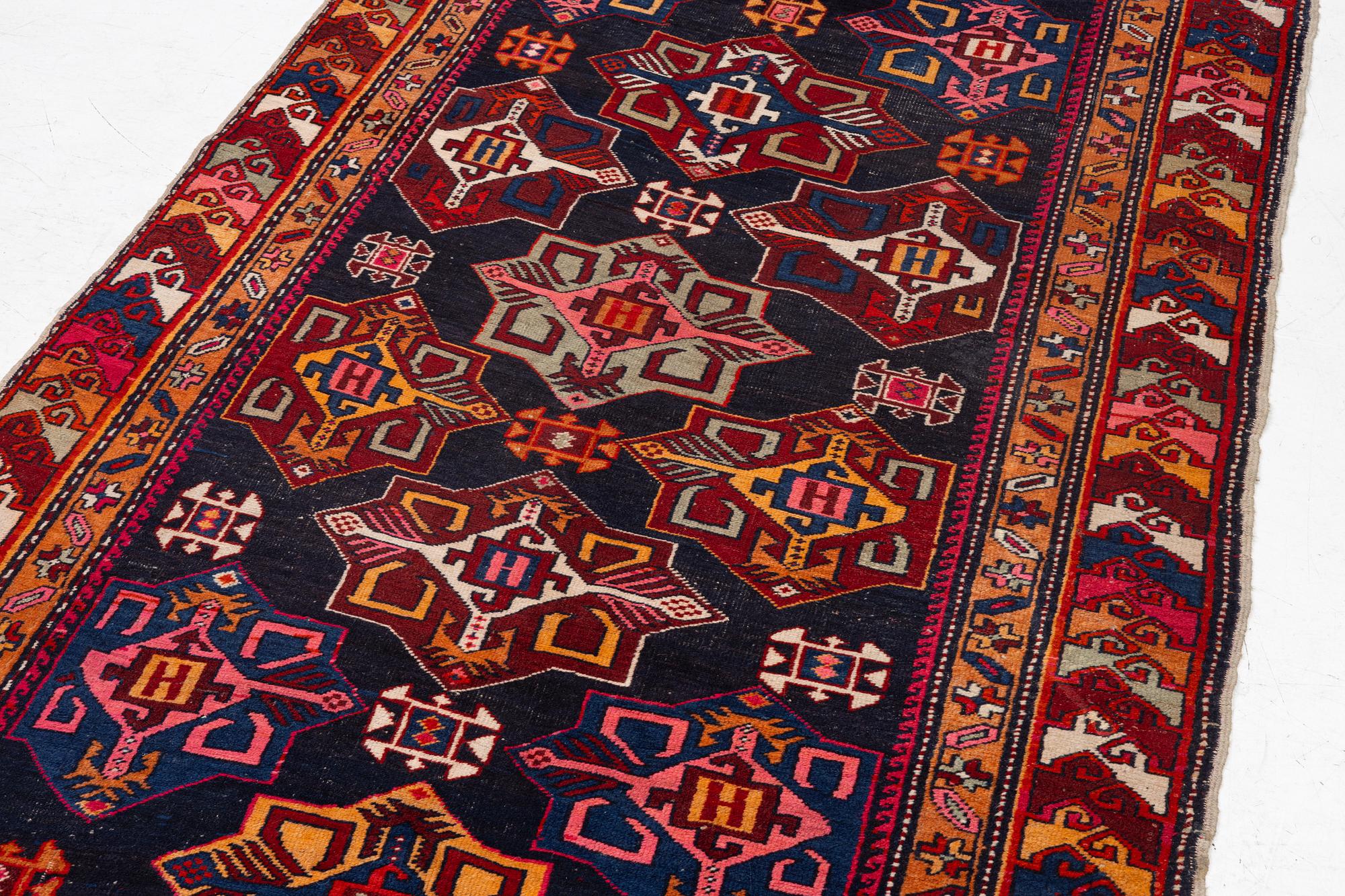 A semi-antique Anatolian runner, c. 409 x 159 cm.