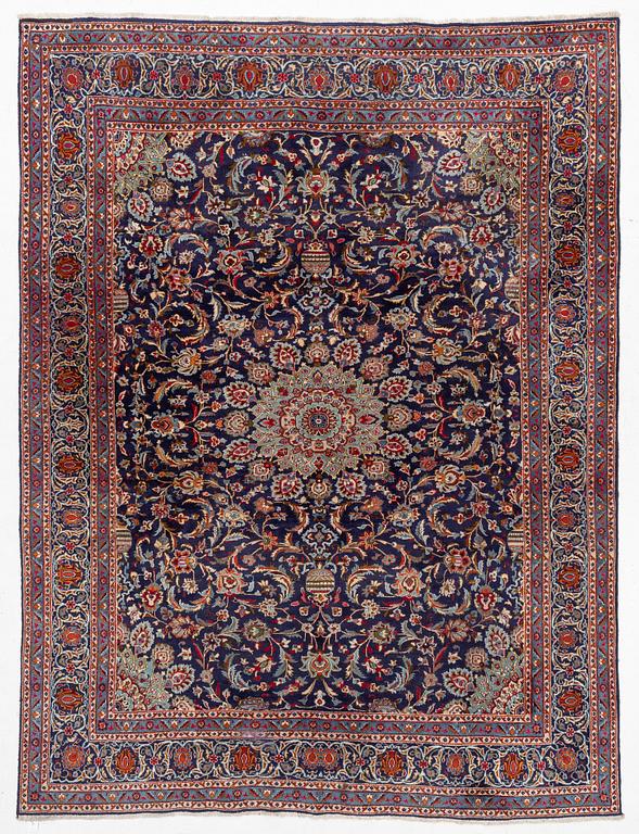 An oriental carpet, c. 390 x 295 cm.