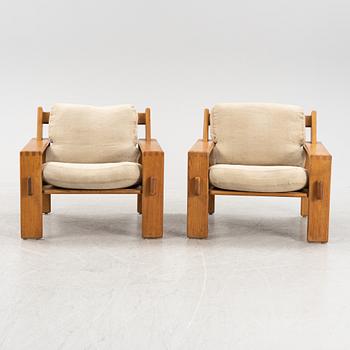 Esko Pajamies, a pair of oak 'Bonanza' lounge chairs from Asko, 1970's.