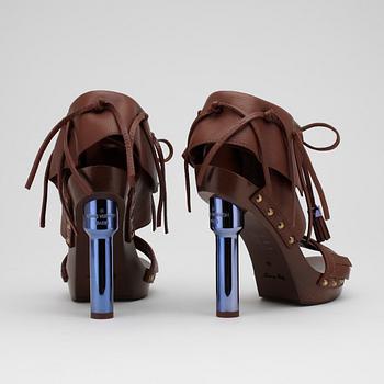 LOUIS VUITTON, a pair of brown leather platform sandalettes.