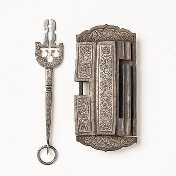 A Shokpa-shaped lock, inlaid with silver threads, Tibet, 19th century. 'Ashtamangala'.