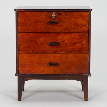 A 1930s functionalist style chest of drawer.