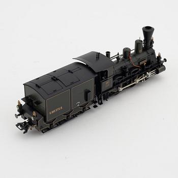 Märklin, a steam locomotive 3497 and car set no 4897, in boxes.