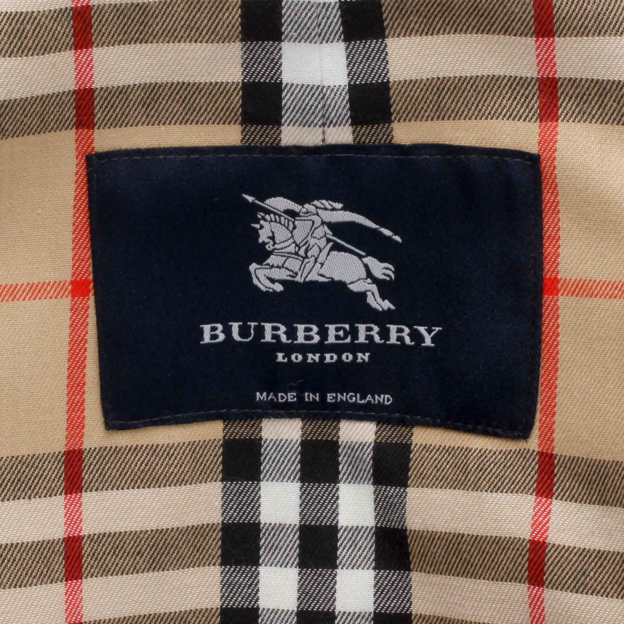 BURBERRY, a beige cotton blend trench coat and a shawl.