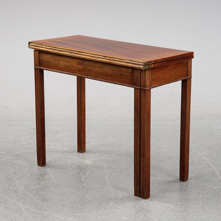 A mahogany games table, circa 1800.