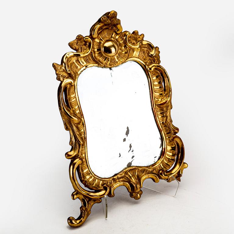 A mid 18th century gilded rococo mirror.