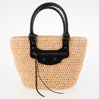 BALENCIAGA Panier leather-trimmed woven raffia tote with a silk scarf.