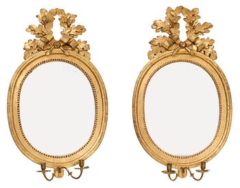 A very similar pair of Gustavian two-light girandole mirrors by N. Meunier.