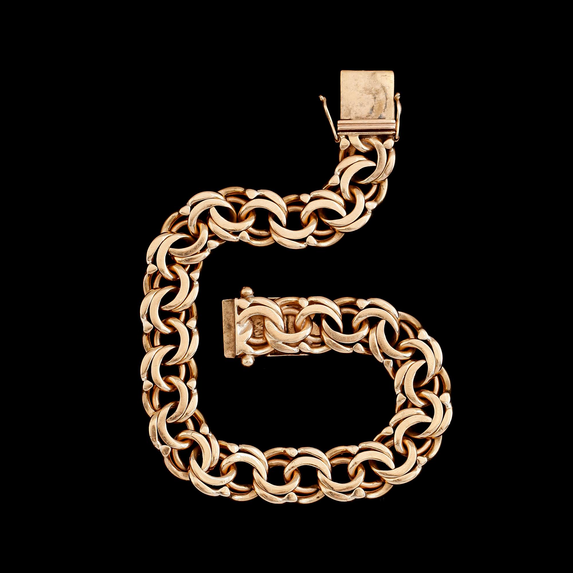 ARMBAND, 18 k guld, bolidenguld, 1947. Total vikt ca 31 g.