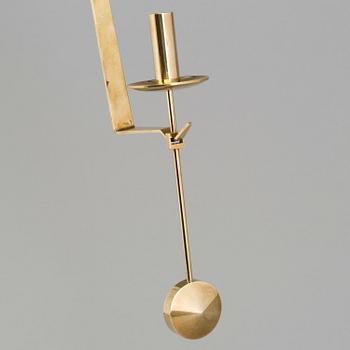 A pair of 20th century brass wall candleholders "Pendel" design Pierre Forssell for Skltuna, Sweden.