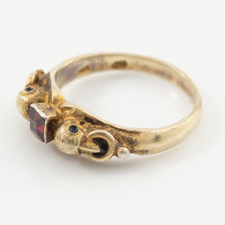 Two rings in silver with pink/red stones.