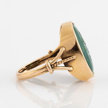 Green carved stone ring.