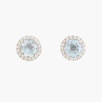 Blue topaz and brilliant cut diamond earrings and necklace.