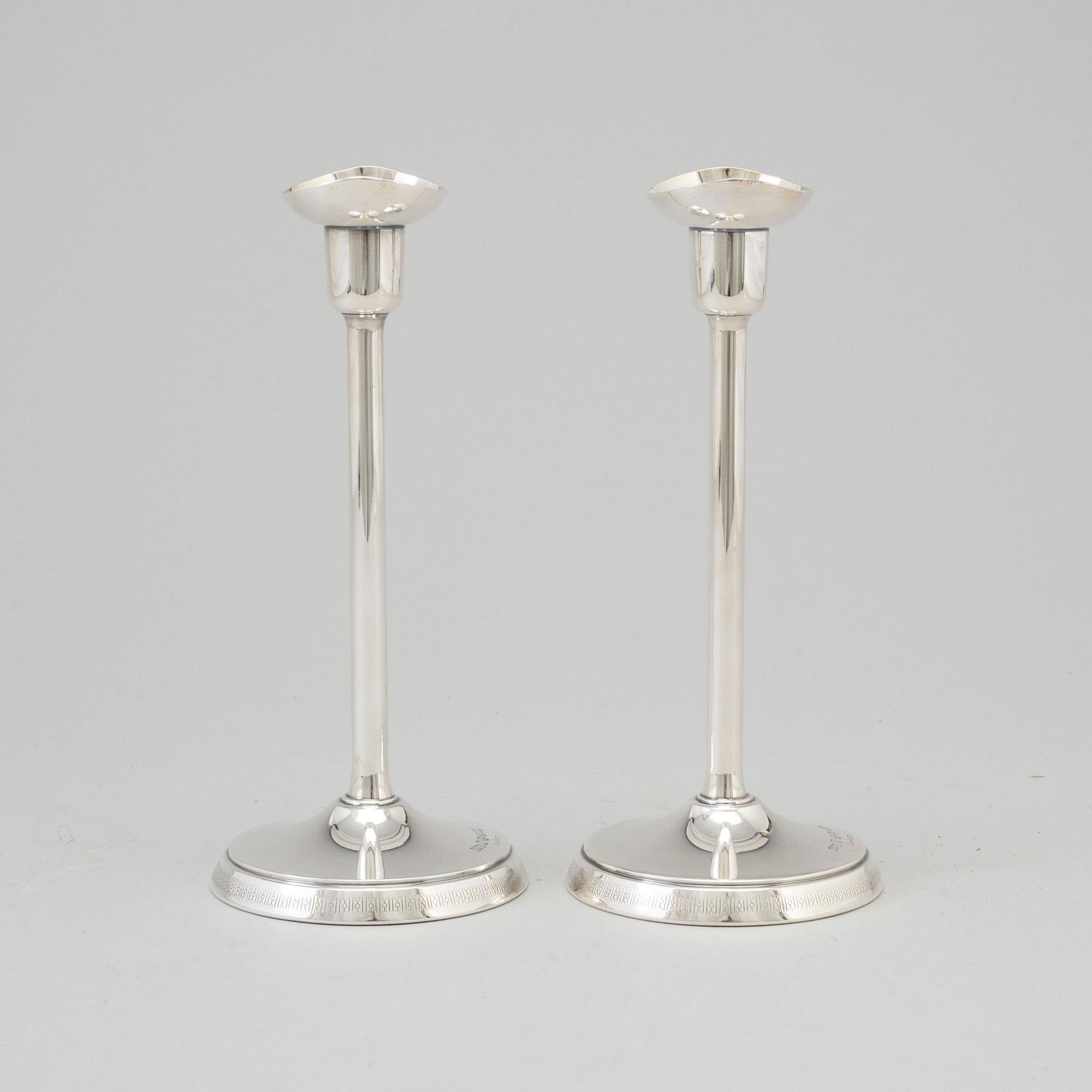 A pair of silver candlesticks by GAB, Stockholm, 1970.