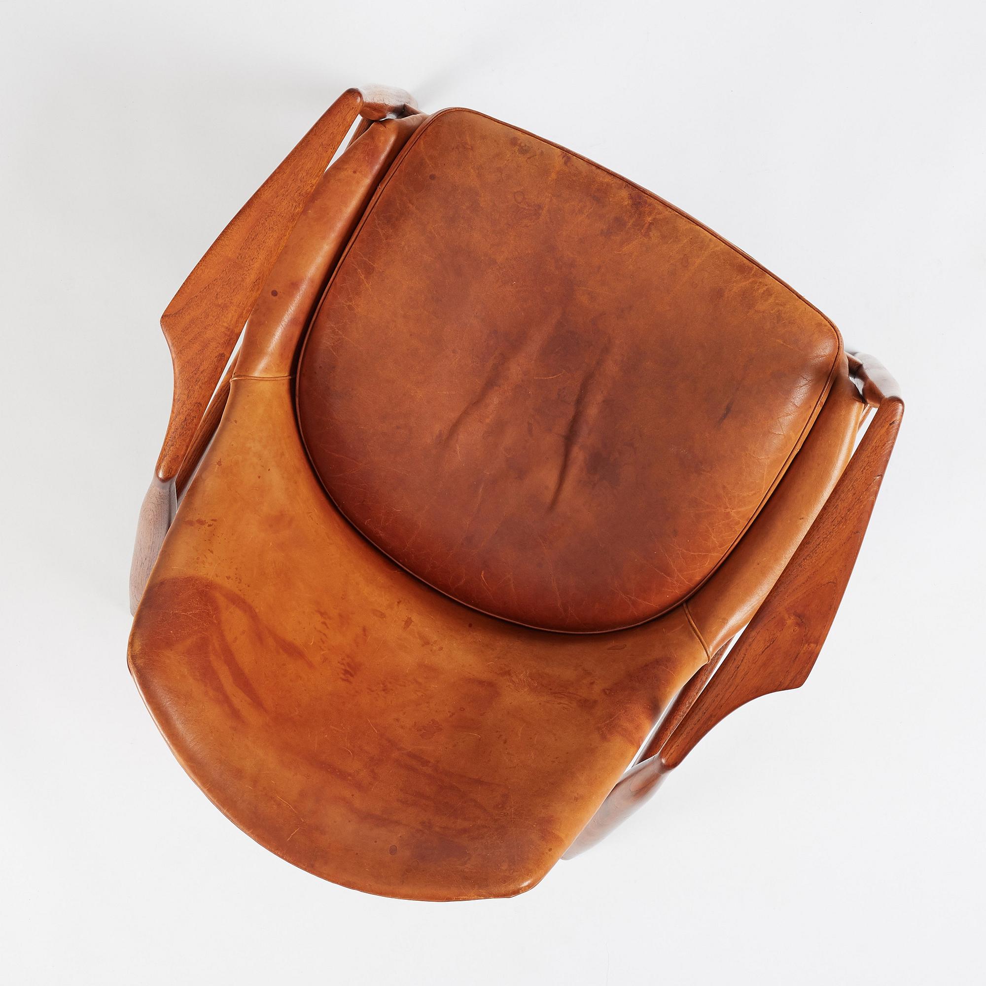 Ib Kofod-Larsen, a teak and cognac coloured leather 'Sälen' easy chair, Olof Perssons Fåtöljindustri (OPE), Sweden, 1950-60s.