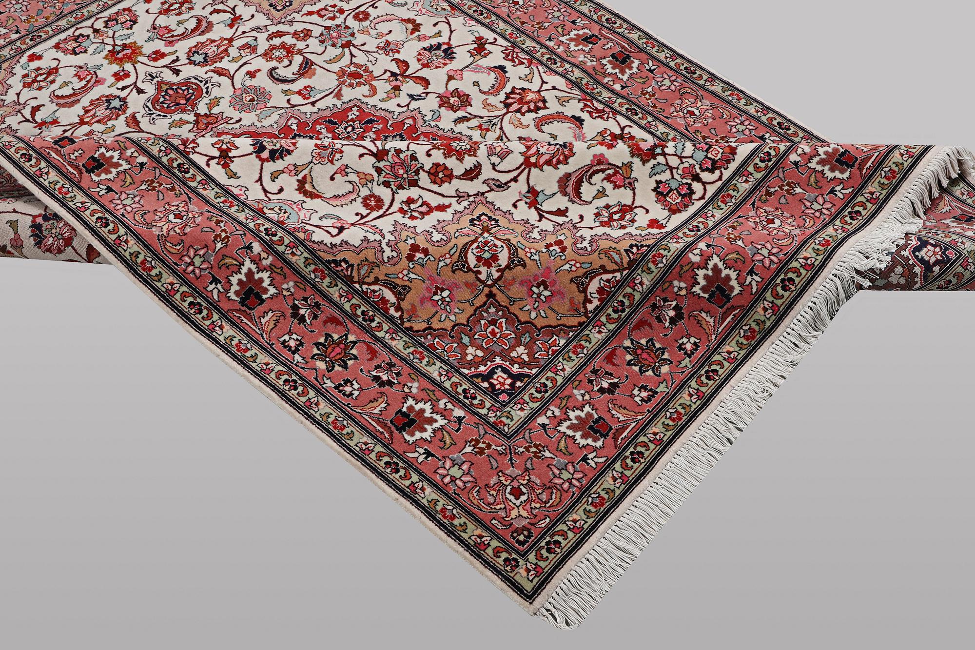 A rug, Tabriz, part silk, 50 Raj, ca 210 x 158 cm.